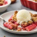 Served rhubarb crisp with vanilla ice cream