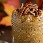 vegan pumpkin pie overnight oats in a mason jar with fall toppings